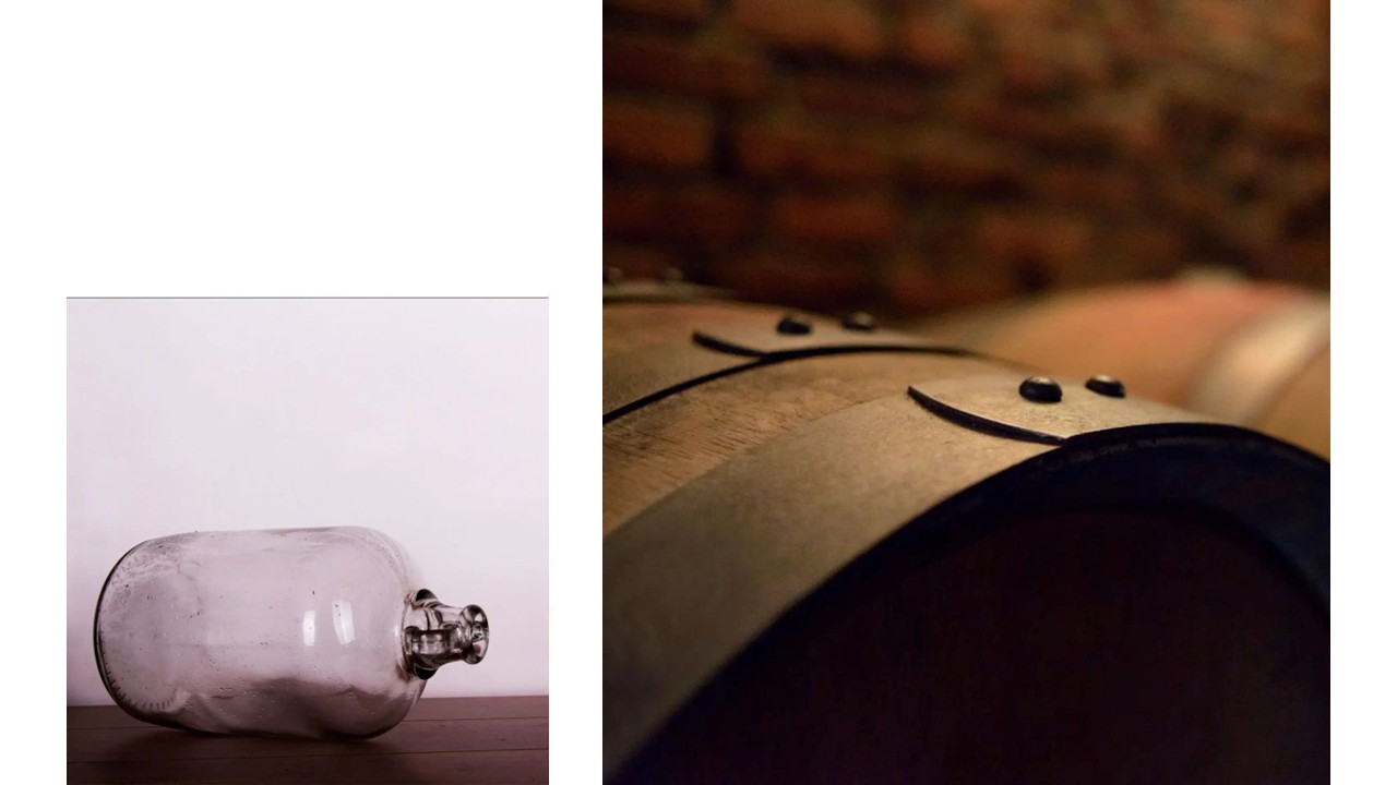 Glass bottle and wooden barrel close-up